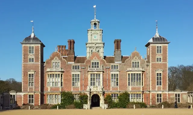 mage showcasing the stunning Blickling Hall amidst the Norfolk Broads, accentuating the allure in this remarkable region. The grandeur of the hall against the scenic backdrop highlights the exquisite experiences available in this renowned waterway."