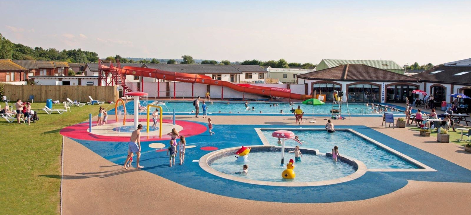 Visiting a holiday park in Norfolk is great for the families. With outside pools like seen in the photo, it's a family fun holiday
